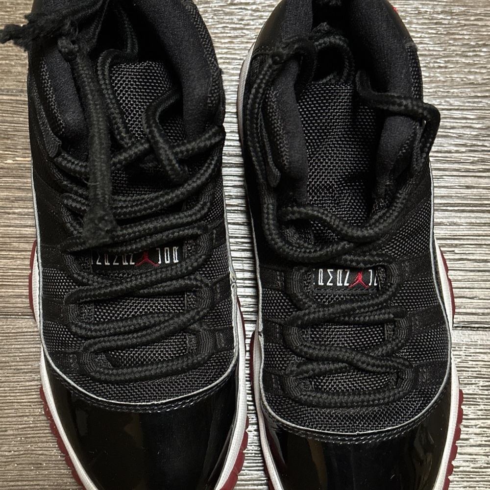 Air Jordan 11 Retro Black and red sneakers. Size 4 youth.